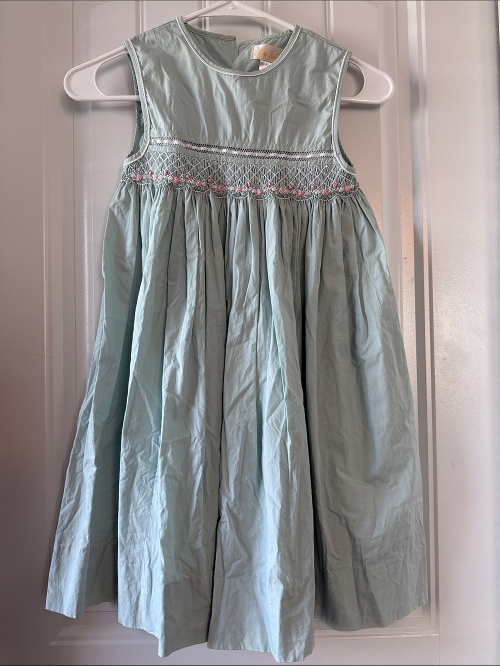 Gently worn Petit Ami Light Blue Smocked Sleeveless Dress with Pink Accents